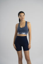 Load image into Gallery viewer, New Balance Womens Seamless Wirefree, Racerback Sports Bra with Removable Pads, Bottom Band with Logo, Camo Magnet
