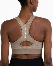 Load image into Gallery viewer, New Balance Women's Seamless MID Impact Heather Keyhole Sport Bra with Removable Pads
